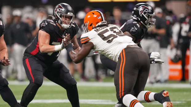 Aug 29, 2021; Atlanta, Georgia, USA; Atlanta Falcons offensive tackle Jalen Mayfield (77) blocks against Cleveland Browns defensive tackle Malik McDowell (58) during the first half at Mercedes-Benz Stadium. Mandatory Credit: Dale Zanine-USA TODAY Sports