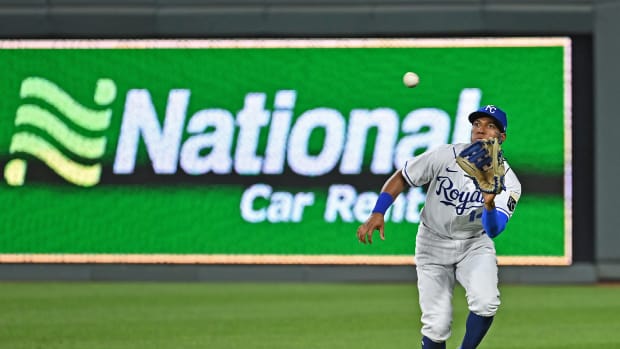 Sep 2, 2021; Kansas City, Missouri, USA; Kansas City Royals right fielder Edward Olivares (14) runs in to catch a fly ball during the ninth inning against the Cleveland Indians at Kauffman Stadium. Mandatory Credit: Peter Aiken-USA TODAY Sports