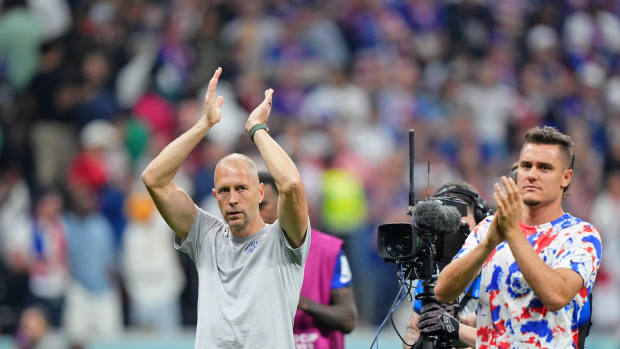 Nov 25, 2022; Al Khor, Qatar; United States of America manager Gregg Berhalter and defender Aaron Long (15) acknowledge fans after a group stage match against England during the 2022 World Cup at Al Bayt Stadium.