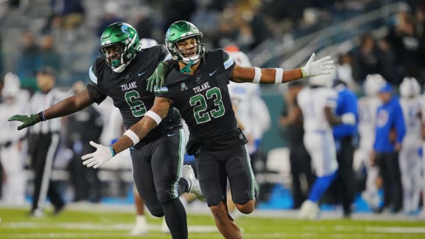 Nov 17, 2022; New Orleans, Louisiana, USA; Tulane Green Wave safety Lummie Young IV (23) celebrates an interception against the Southern Methodist Mustangs during the second half at Yulman Stadium. Mandatory Credit: Andrew Wevers-USA TODAY Sports