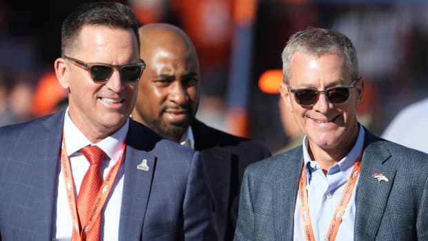 Denver Broncos CEO Greg Penner (right) and general manager George Paton (left) before the game against the Las Vegas Raiders at Empower Field at Mile High.
