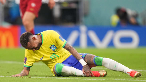 Neymar pictured on the ground during Brazil's 2-0 win over Serbia at the 2022 World Cup after sustaining ligament damage in his right ankle