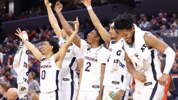 Virginia Cavaliers players celebrate on the bench in the final minutes against the Maryland-Eastern Shore Hawks in the second half at John Paul Jones Arena.