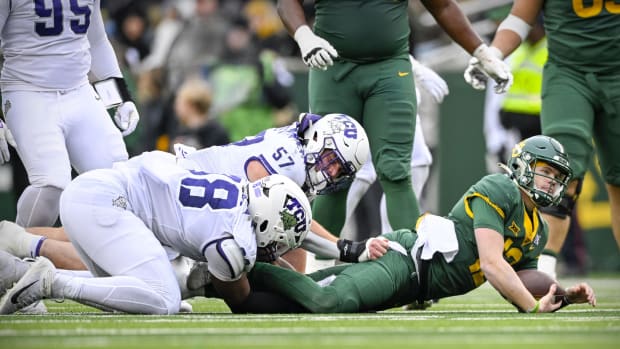Nov 19, 2022; Waco, Texas, USA; Baylor Bears quarterback Blake Shapen (12) is sacked by TCU Horned Frogs linebacker Johnny Hodges (57) and defensive lineman Dylan Horton (98) during the second quarter at McLane Stadium.