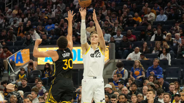 Utah Jazz forward Lauri Markkanen (23) shoots against Golden State Warriors guard Stephen Curry (30) during the third quarter at Chase Center.