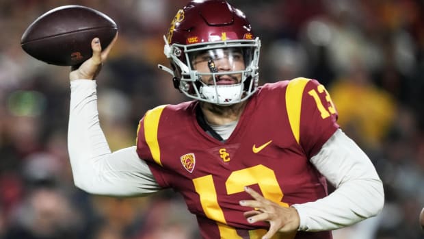 Nov 26, 2022; Los Angeles, California, USA; Southern California Trojans quarterback Caleb Williams (13) throws the ball against the Notre Dame Fighting Irish in the first half at United Airlines Field at Los Angeles Memorial Coliseum. Mandatory Credit: Kirby Lee-USA TODAY Sports