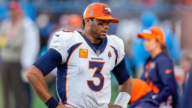 Russell Wilson puts his hands on his hips after another Broncos loss.