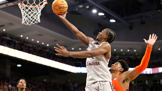 Nov 18, 2022; Auburn, Alabama, USA; Texas Southern Tigers forward Davon Barnes (2) drives past Auburn Tigers center Dylan Cardwell (44) for layup during the first half at Neville Arena.