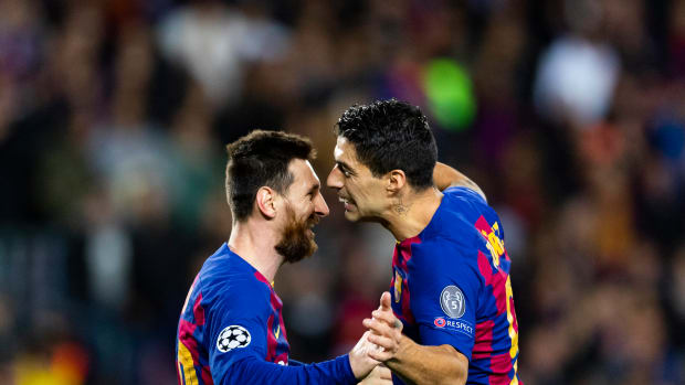 Lionel Messi (left) and Luis Suarez pictured celebrating a goal during Barcelona's win over Dortmund in November 2019