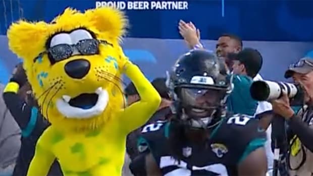 Jaguars mascot jaxson de ville dances after JaMycal Hasty (22) scores a touchdown.