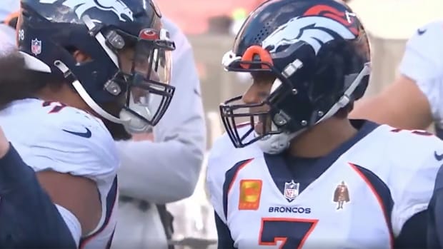 Defensive tackle Mike Purcell yells at Russell Wilson during a Broncos game.