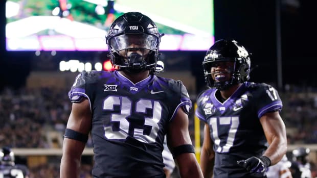 Oct 22, 2022; Fort Worth, Texas, USA; TCU Horned Frogs running back Kendre Miller (33) celebrate scoring a touchdown against the Kansas State Wildcats in the fourth quarter at Amon G. Carter Stadium
