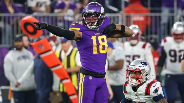 Vikings receiver Justin Jefferson signals first down after one of his nine catches against the Patriots in Week 12.