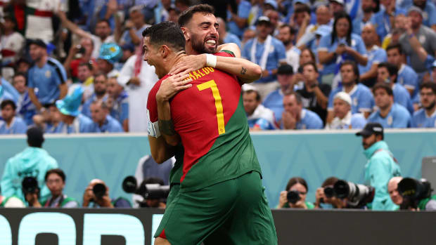 Bruno Fernandes and Cristiano Ronaldo celebrate Portugal’s goal