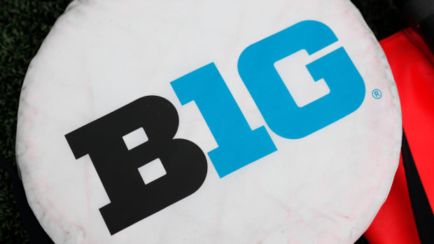 A close-up of a Big Ten logo on a sideline marker before a game.
