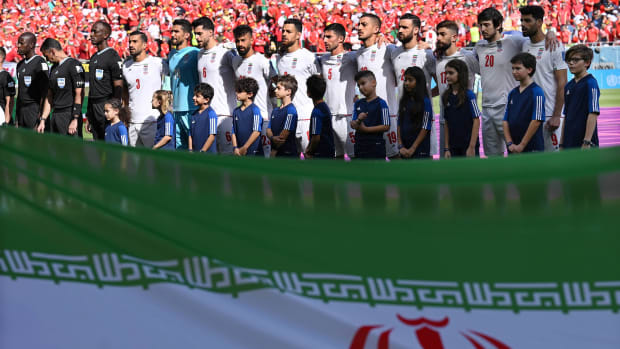 The Iran men's national soccer team stands for the national anthem prior to a match vs. Wales.