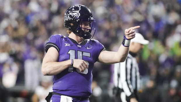Nov 26, 2022; Fort Worth, Texas, USA; TCU Horned Frogs quarterback Max Duggan (15) points at his receiver after thrown a touchdown pass against the Iowa State Cyclones during second half at Amon G. Carter Stadium.
