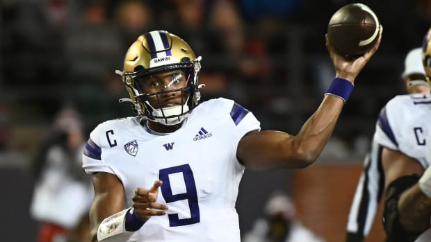 Michael Penix Jr. threw for 3 touchdowns and scored 2 more by rushing in the Apple Cup.