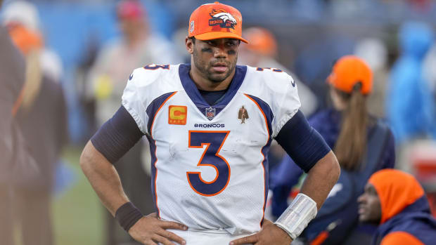 Denver Broncos quarterback Russell Wilson (3) watches as the closing seconds tick away during the second half against the Carolina Panthers at Bank of America Stadium.