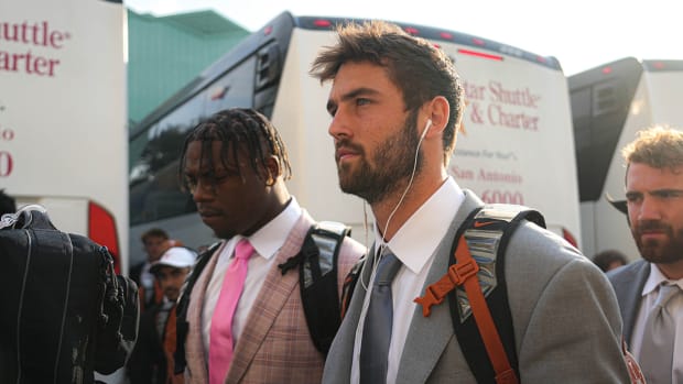 Texas quarterback Hudson Card and his teammates head to the locker room before the annual Red River Showdown against Oklahoma at the Cotton Bowl.