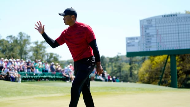 Tiger Woods walks off the 18th green during the final round of the 2022 Masters at Augusta National Golf Club.