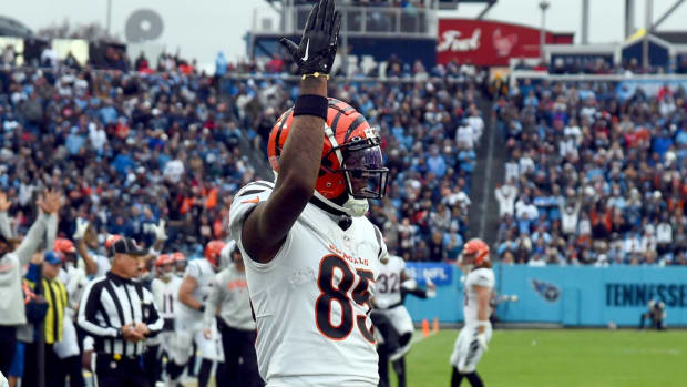 Nov 27, 2022; Nashville, Tennessee, USA; Cincinnati Bengals wide receiver Tee Higgins (85) reacts after scoring against Tennessee Titans cornerback Roger McCreary (21) during the second half at Nissan Stadium. Mandatory Credit: Christopher Hanewinckel-USA TODAY Sports