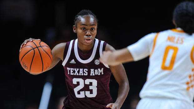 Jan 6, 2022; Knoxville, Tennessee, USA; Texas A&M Aggies guard McKinzie Green (23) brings the ball up court against Tennessee Lady Vols guard Brooklynn Miles (0) during the second half against the Tennessee Lady Vols at Thompson-Boling Arena. Mandatory Credit: Bryan Lynn-USA TODAY Sports