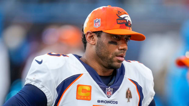 Broncos quarterback Russell Wilson stands on the sidelines during the game vs. the Panthers.