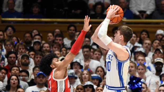 Duke Blue Devils center Kyle Filipowski(30) shoots over Ohio State Buckeyes forward Justice Sueing (14) during the first half at Cameron Indoor Stadium.