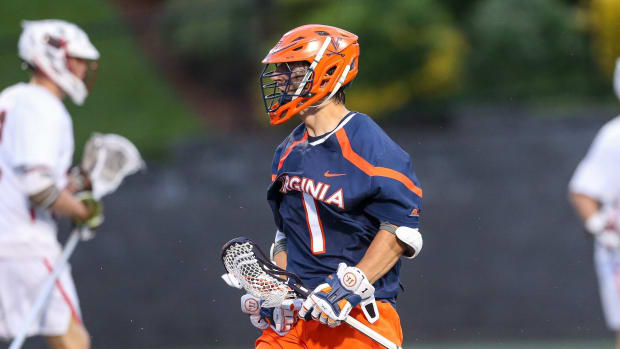 Connor Shellenberger celebrates after scoring a goal for the Virginia men's lacrosse team against Brown in the NCAA Tournament.