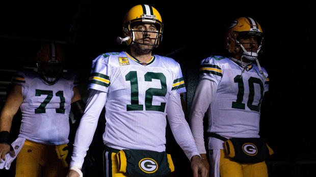 Aaron Rodgers and Jordan Love walk out of the tunnel