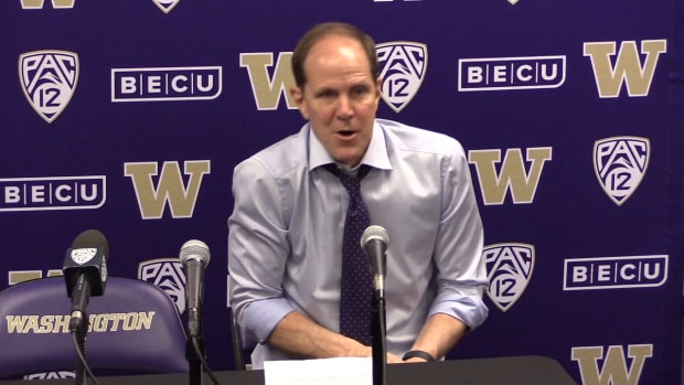 Mike Hopkins gets animated in his postgame news conference.