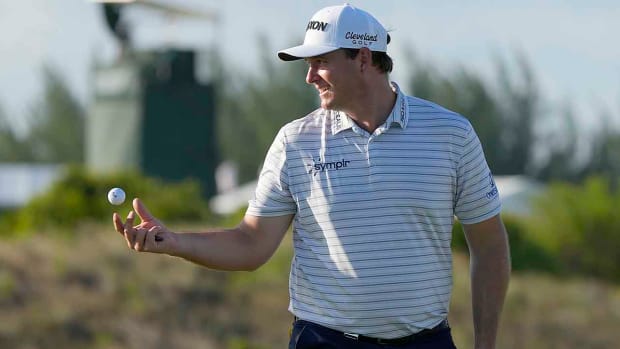 Sepp Straka tosses his ball to his caddie at the first round of the 2022 Hero World Challenge.