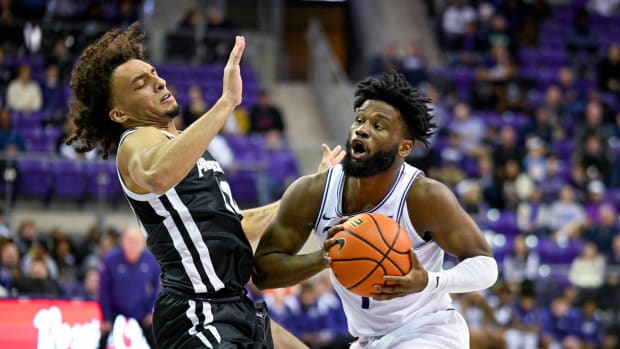 Providence Friars guard Devin Carter (22) defends against TCU Horned Frogs guard Mike Miles Jr. (1) during the first half at Ed and Rae Schollmaier Arena.