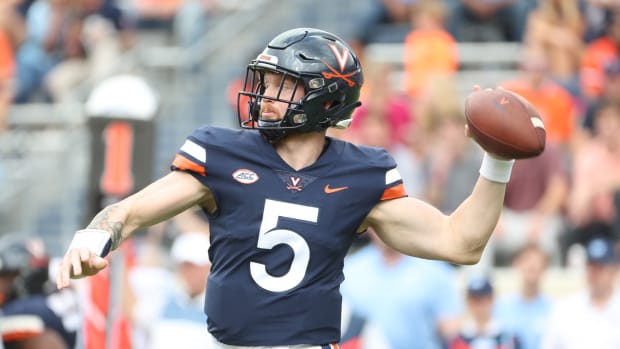 Brennan Armstrong attempts a pass during the Virginia football game against North Carolina at Scott Stadium.