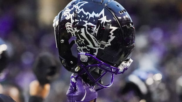 Nov 26, 2022; Fort Worth, Texas, USA; A TCU helmet raised in the air during second half against the Iowa State Cyclones at Amon G. Carter Stadium.