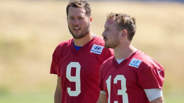 Rams quarterbacks Matthew Stafford and John Wolford stand on the sidelines during an offseason minicamp practice.