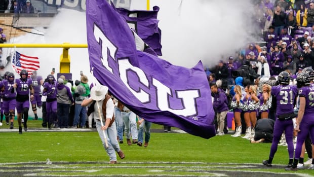 Nov 26, 2022; Fort Worth, Texas, USA; The TCU Horned Frogs take the field prior to a game against the Iowa State Cyclones at Amon G. Carter Stadium.
