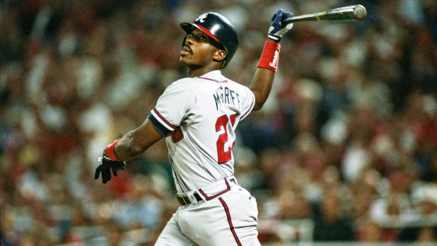 Braves first baseman Fred McGriff bats against the Phillies.