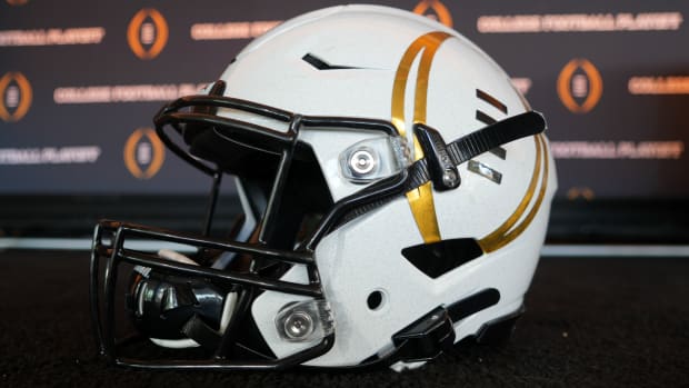 A detailed view of a helmet with the College Football Playoff logo at CFP press conference at Banc of California Stadium.