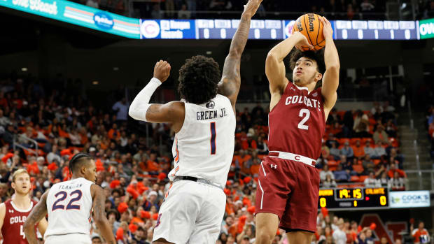 Dec 2, 2022; Auburn, Alabama, USA; Colgate Raiders guard Braeden Smith (2) takes a shot over Auburn Tigers guard Wendell Green Jr. (1) during the first half at Neville Arena. Mandatory Credit: John Reed-USA TODAY Sports