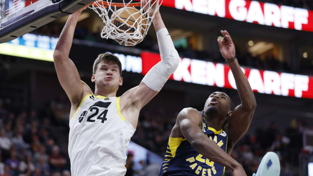 Utah Jazz center Walker Kessler (24) gets the dunk and the foul against Indiana Pacers forward Aaron Nesmith (23) in the fourth quarter at Vivint Arena.