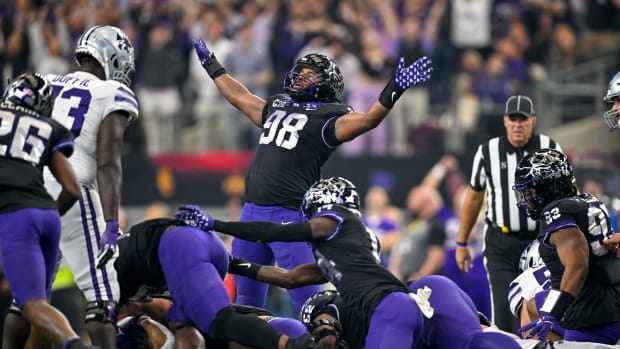 Dec 3, 2022; Arlington, TX, USA; TCU Horned Frogs defensive lineman Dylan Horton (98) celebrates the Frogs making a fourth stop on the Kansas State Wildcats during the second quarter at AT&T Stadium. Mandatory Credit: Jerome Miron-USA TODAY Sports