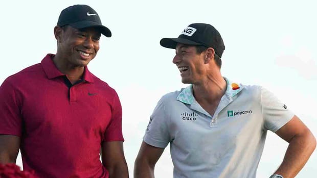Tiger Woods and Viktor Hovland share a laugh after the 2022 Hero World Challenge, won by Hovland.