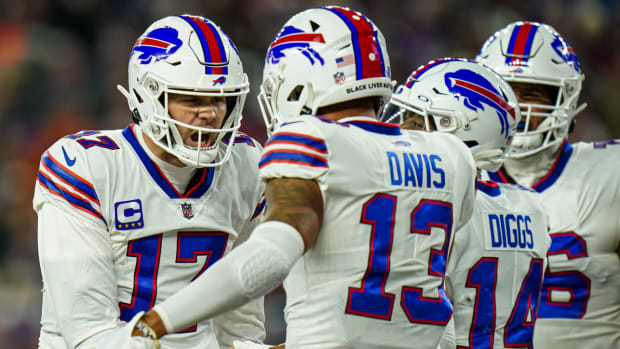 Bills quarterback Josh Allen celebrates with wide receivers Gabe Davis and Stefon Diggs after a touchdown was scored.