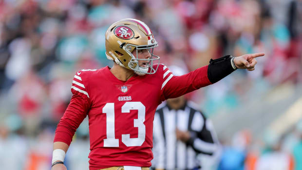 49ers quarterback Brock Purdy celebrates after throwing a touchdown pass in Week 13 against the Dolphins.