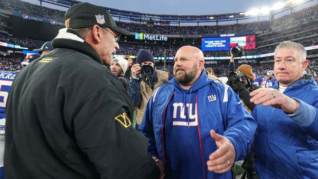Commanders coach Ron Rivera (left) shoes hands with Giants head coach Brian Daboll after the game at MetLife Stadium.
