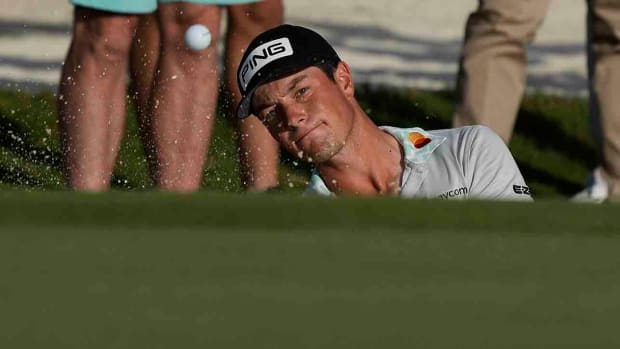 Viktor Hovland hits out of a bunker at the 2022 Hero World Challenge.
