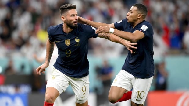 Olivier Giroud and Kylian Mbappe celebrate a goal for France