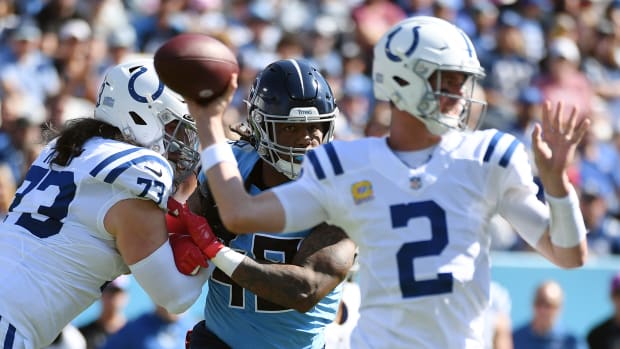 Oct 23, 2022; Nashville, Tennessee, USA; Tennessee Titans linebacker Bud Dupree (48) is blocked by Indianapolis Colts offensive tackle Dennis Kelly (73) as quarterback Matt Ryan (2) attempts a pass during the first half at Nissan Stadium.